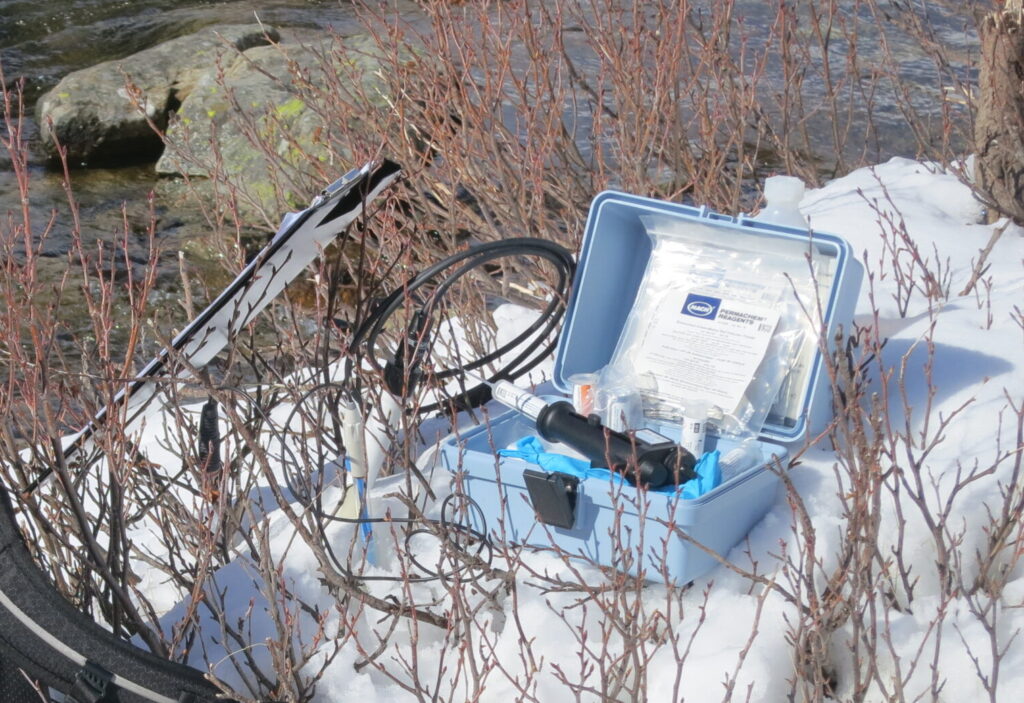 The image shows the field titrator at a river.